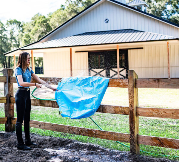 Person Cleaning TroughSaver Liner